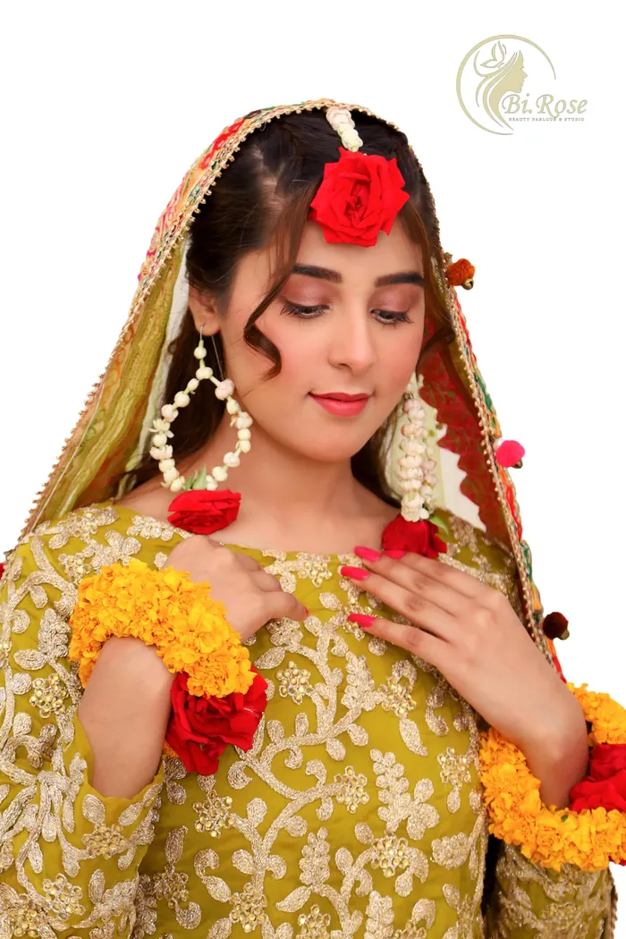 Mehndi look in yellow and green with fresh flowers