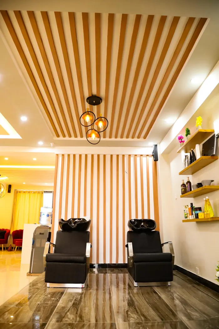 Hair wash stations with wooden slat walls